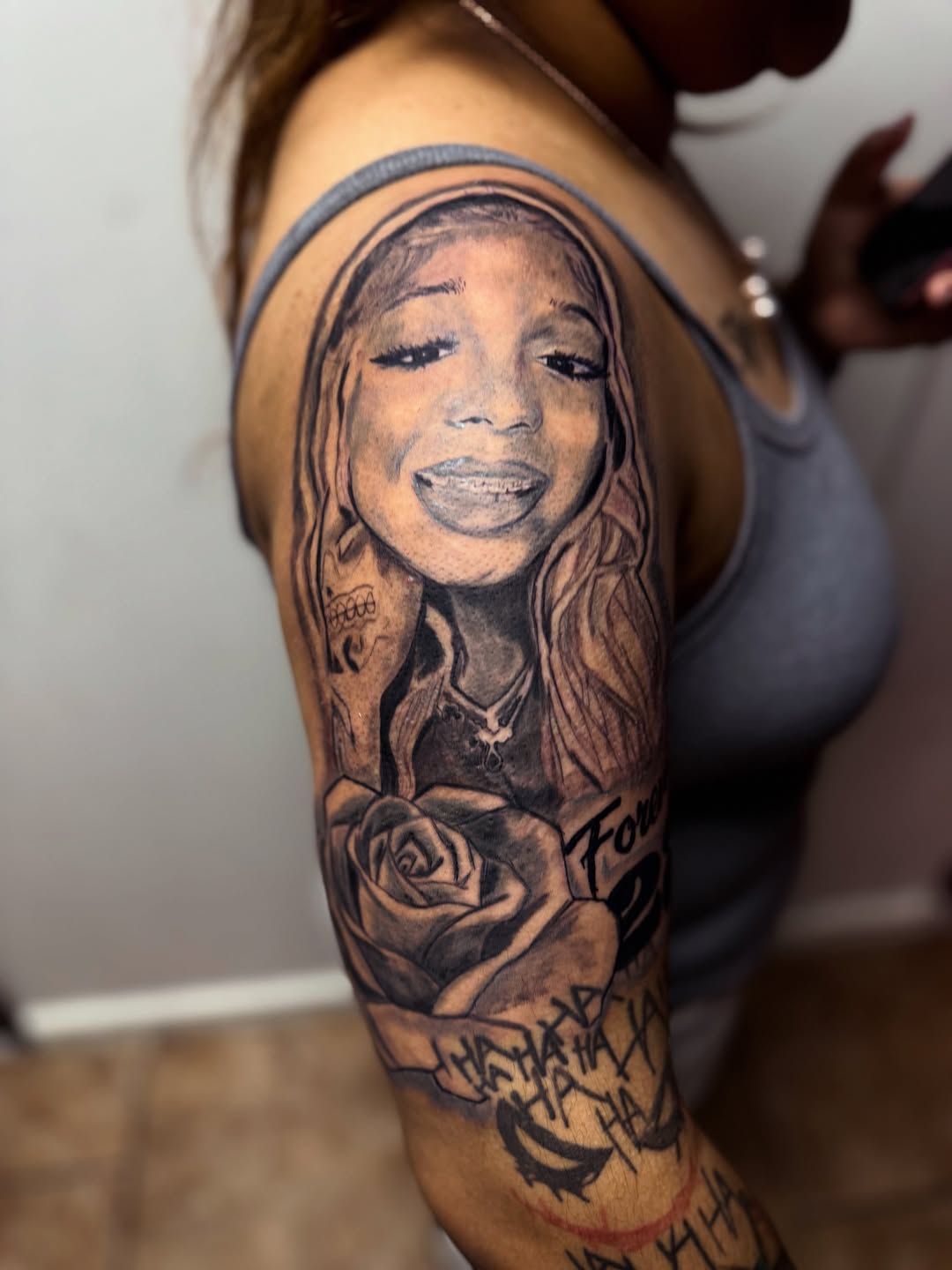 Chicano tattoo on the upper arm by Uncle Fade Tattoo Artist ✍🏾