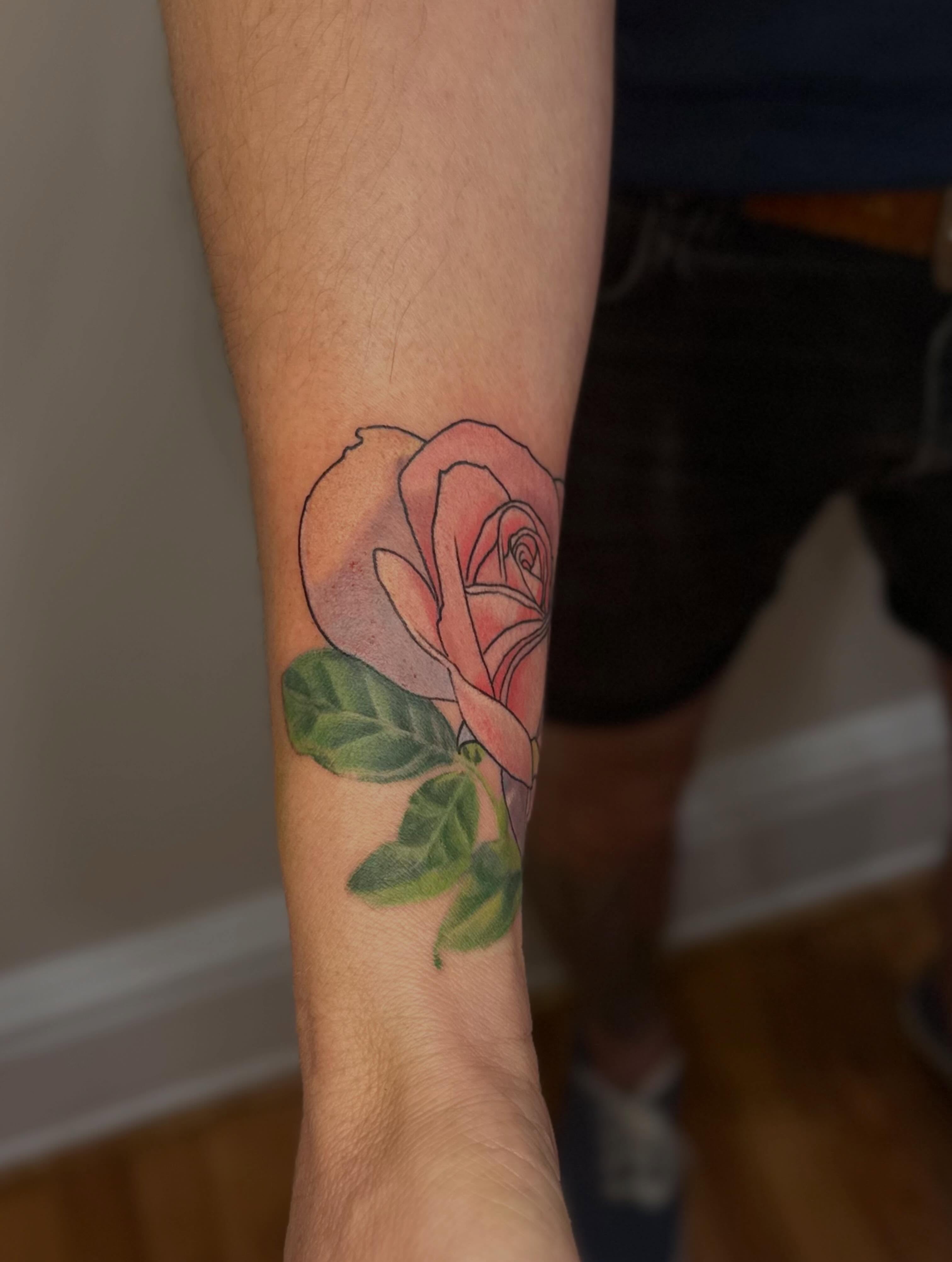 Rose realism tattoo on the forearm by Micha Sol