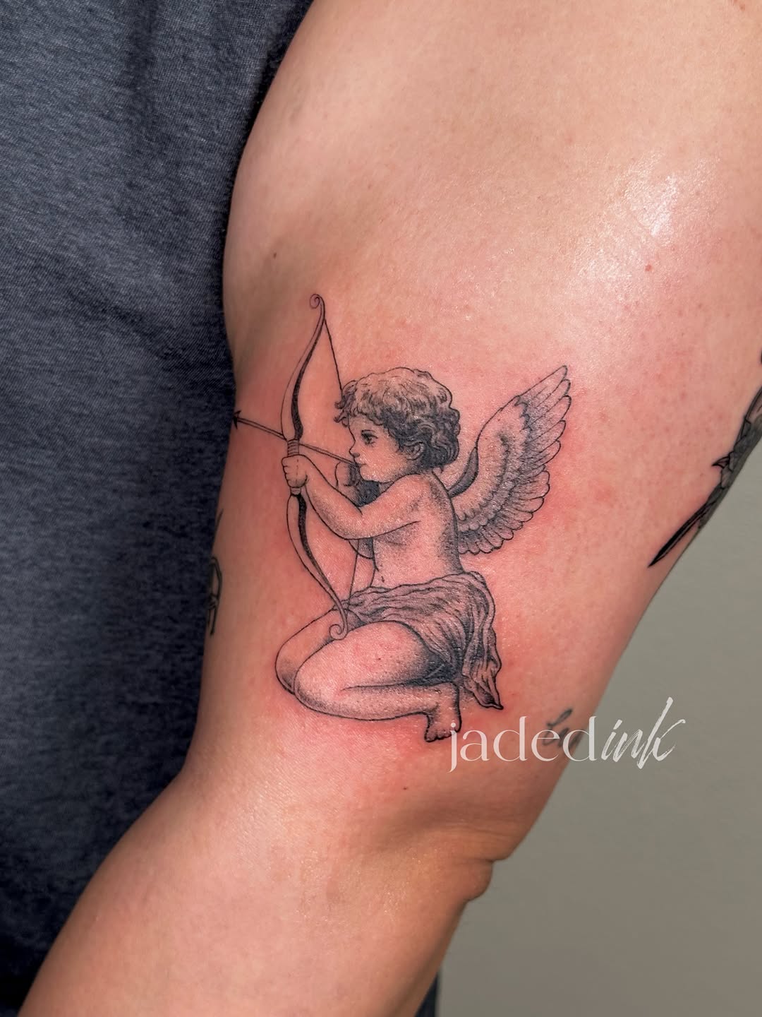 Cherub with bow and arrow ignorant tattoo on the forearm by 𝑱𝒂𝒅𝒆𝒅 𝑰𝒏𝒌 𝑷𝒆𝒓𝒎𝒂𝒏𝒆𝒏𝒕 𝑴𝒂𝒌𝒆𝒖𝒑 & 𝑻𝒂𝒕𝒕𝒐𝒐
