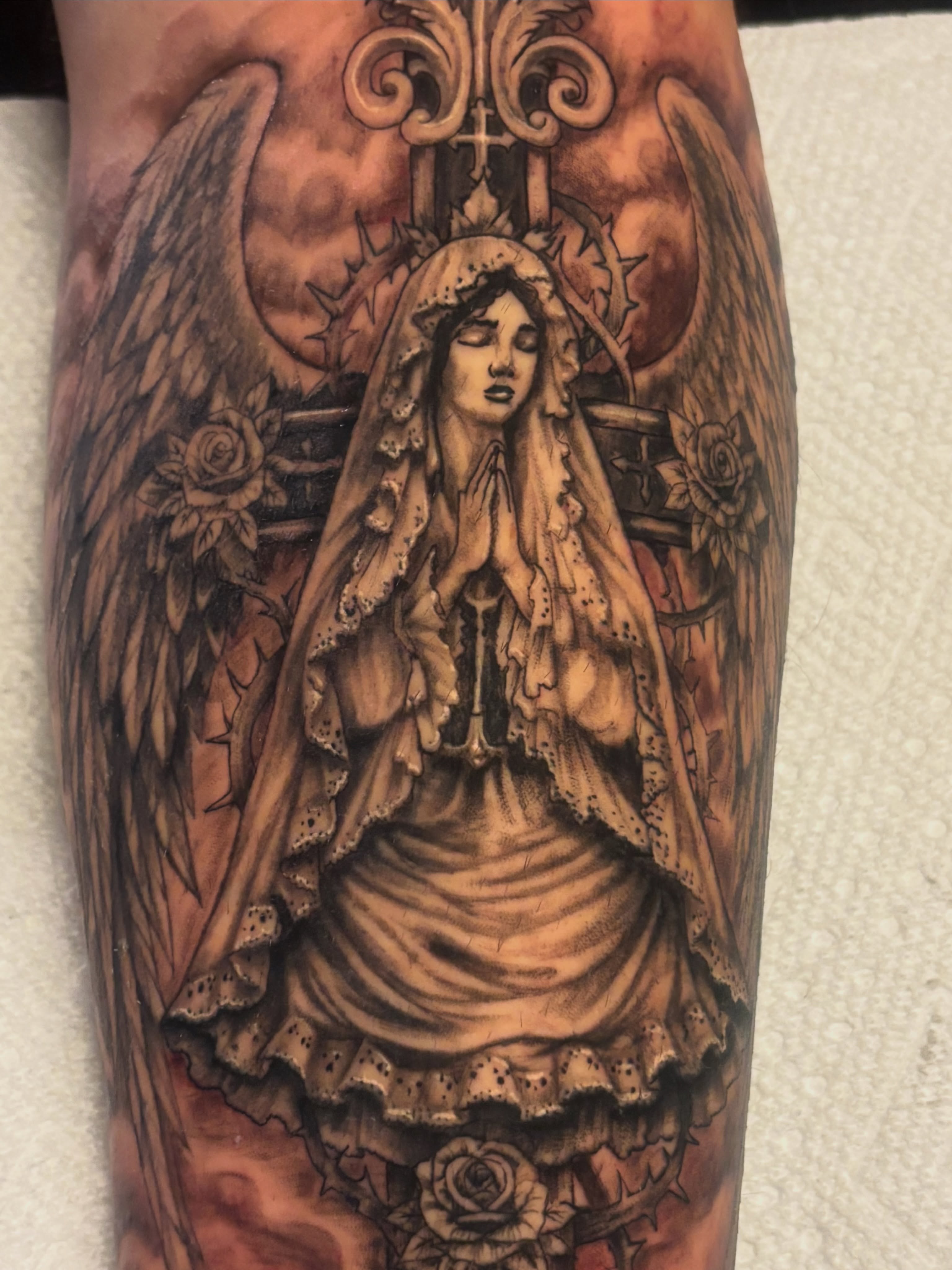 Praying angel realism tattoo on the forearm by Terik Whittaker