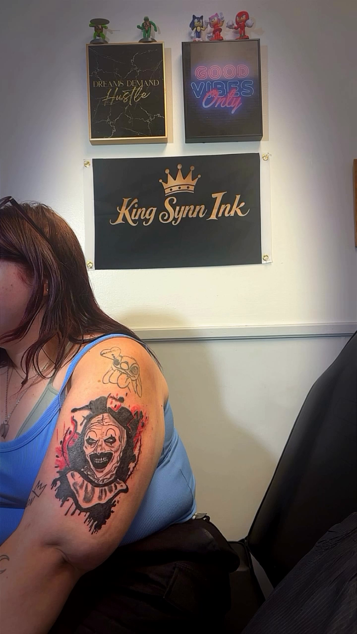 Skull with crown and roses realism tattoo on the upper arm by Syneca Wilson, Acton, Massachusetts