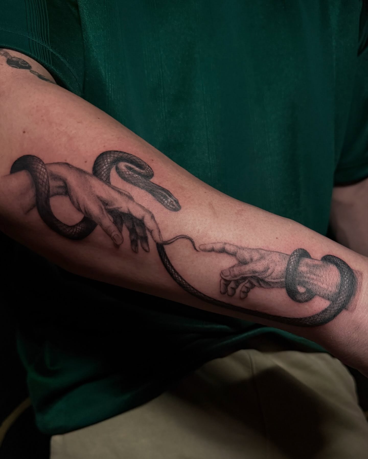 Snake and hands realism tattoo on the forearm by Las Vegas Artist π©π½βπ¨