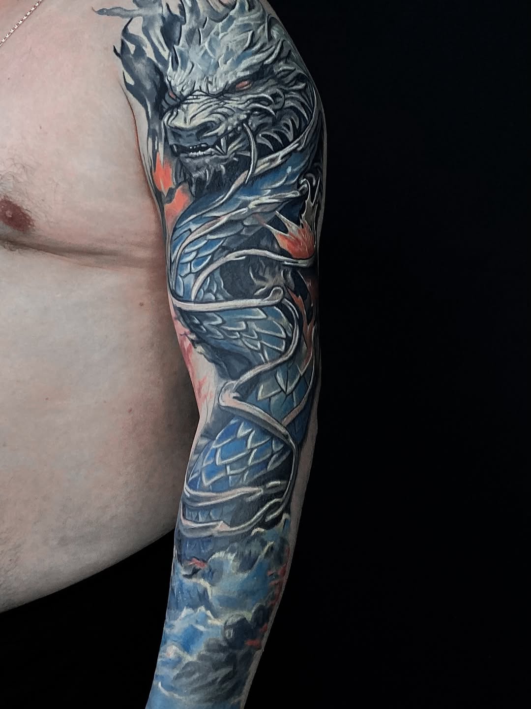 Dragon sleeve Japanese tattoo on the upper arm by Alexey Molyarenko