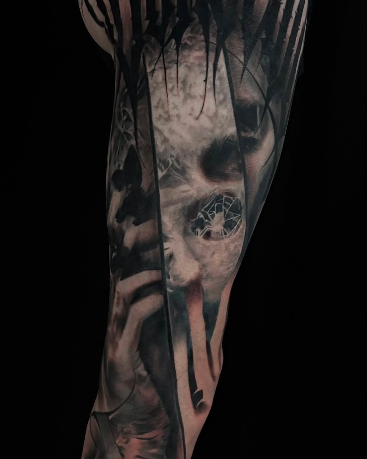 Surreal portrait with spiderweb dark art tattoo on the forearm by Jesse White, Mentor, Ohio