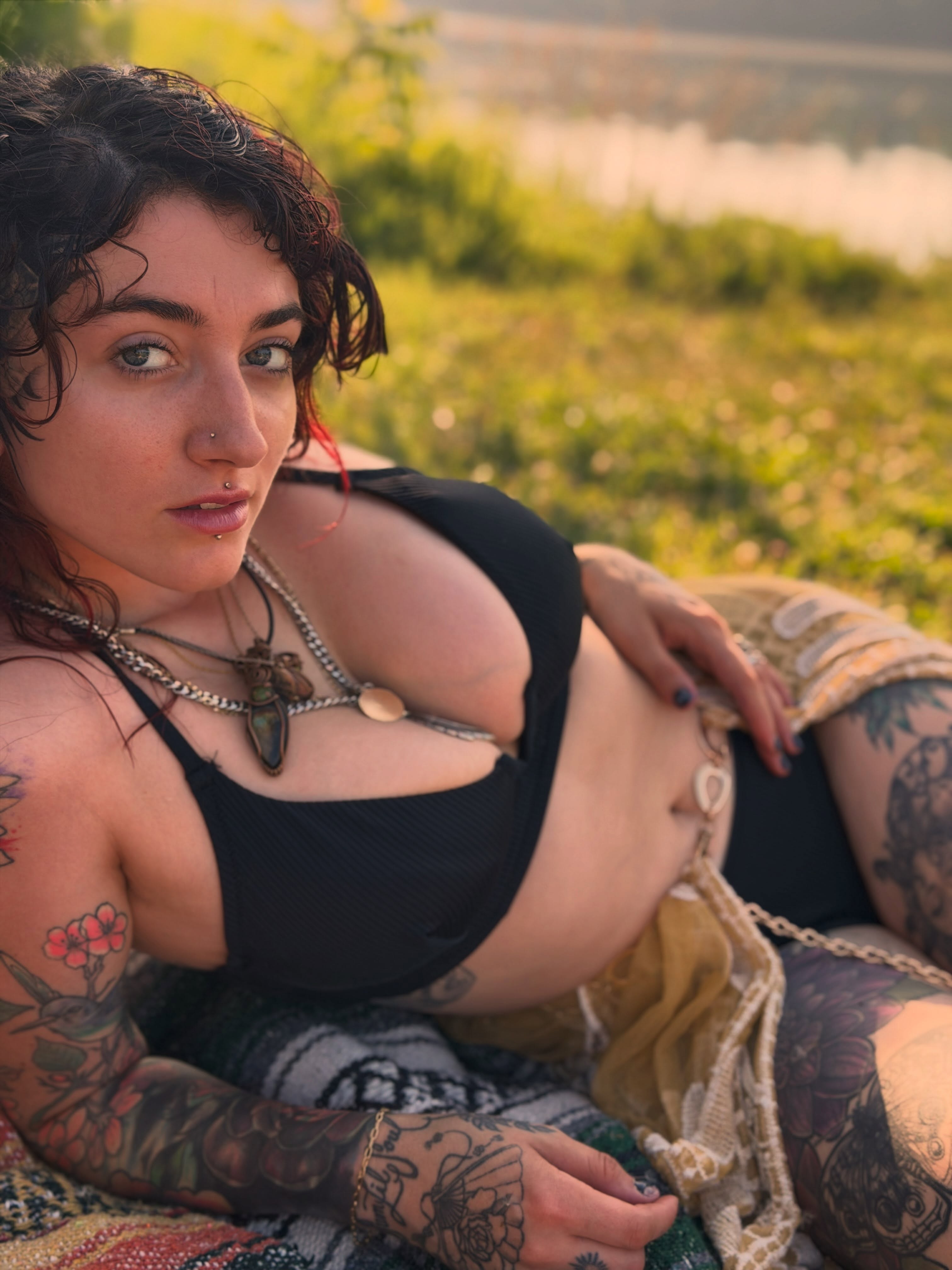 Tattooed woman American traditional tattoo on the torso by Summer Christman