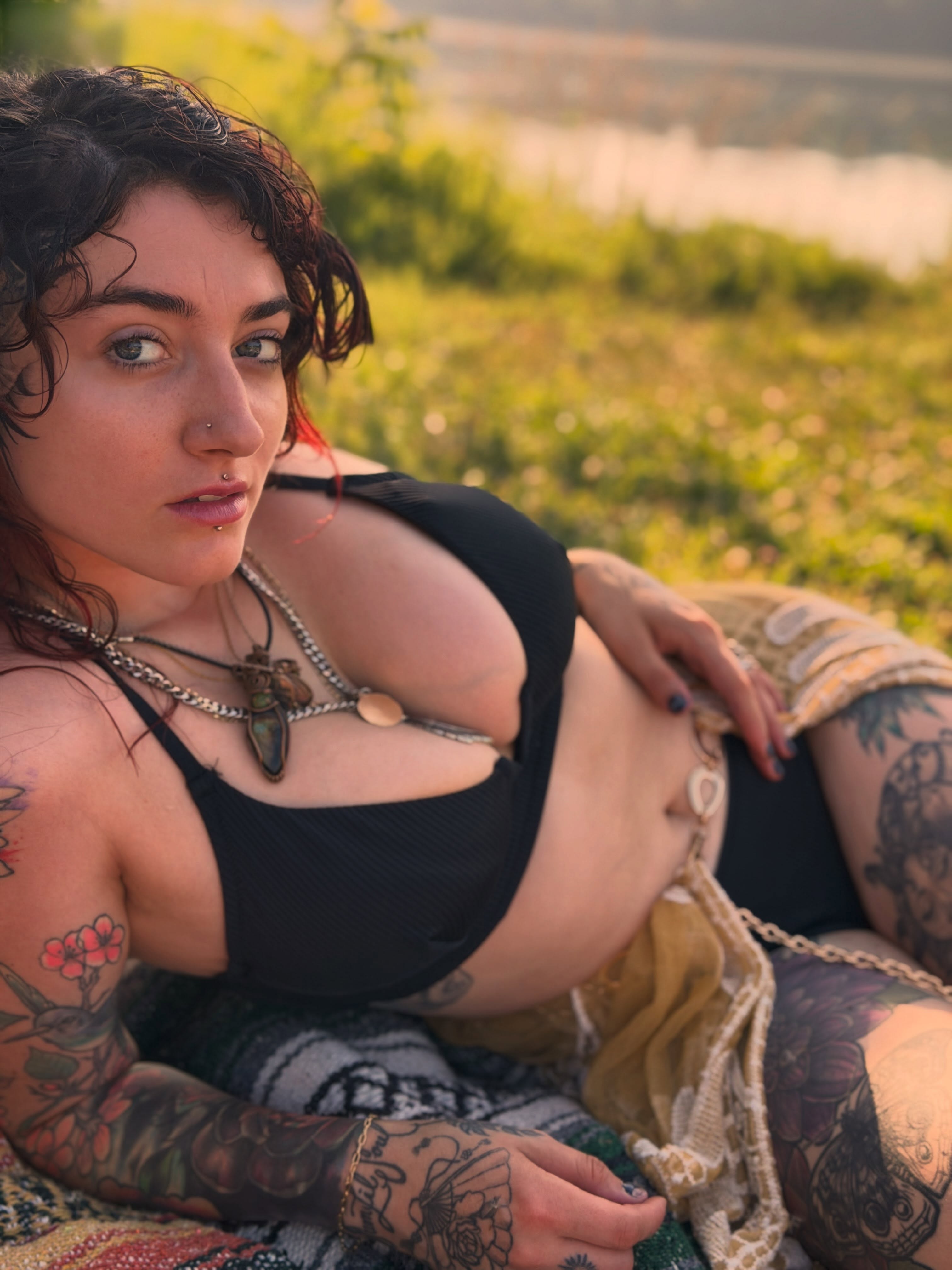 Tattooed woman American traditional tattoo on the torso by Summer Christman