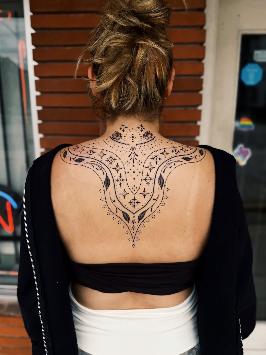 Ornamental back piece dotwork tattoo on the back by @amandahowtattoo