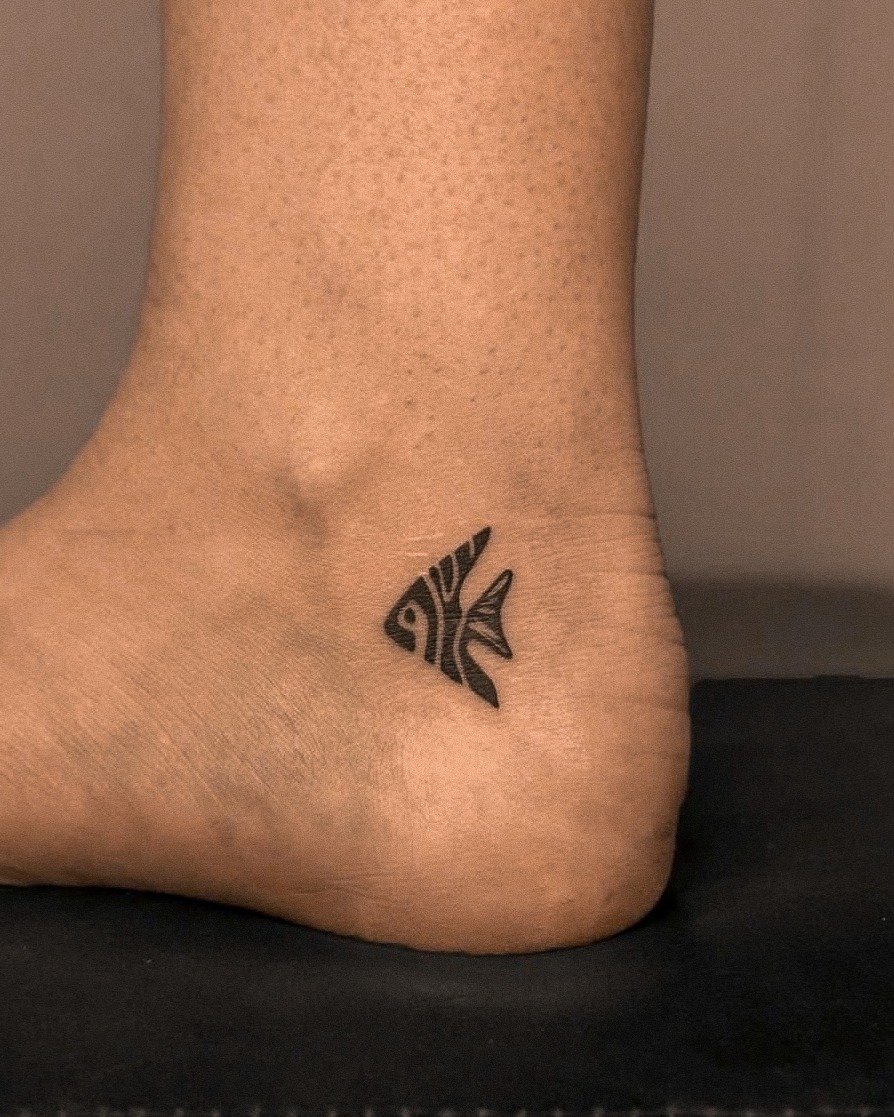 Angelfish fine line tattoo on the foot by Richmond tattoo shop, Richmond, Texas