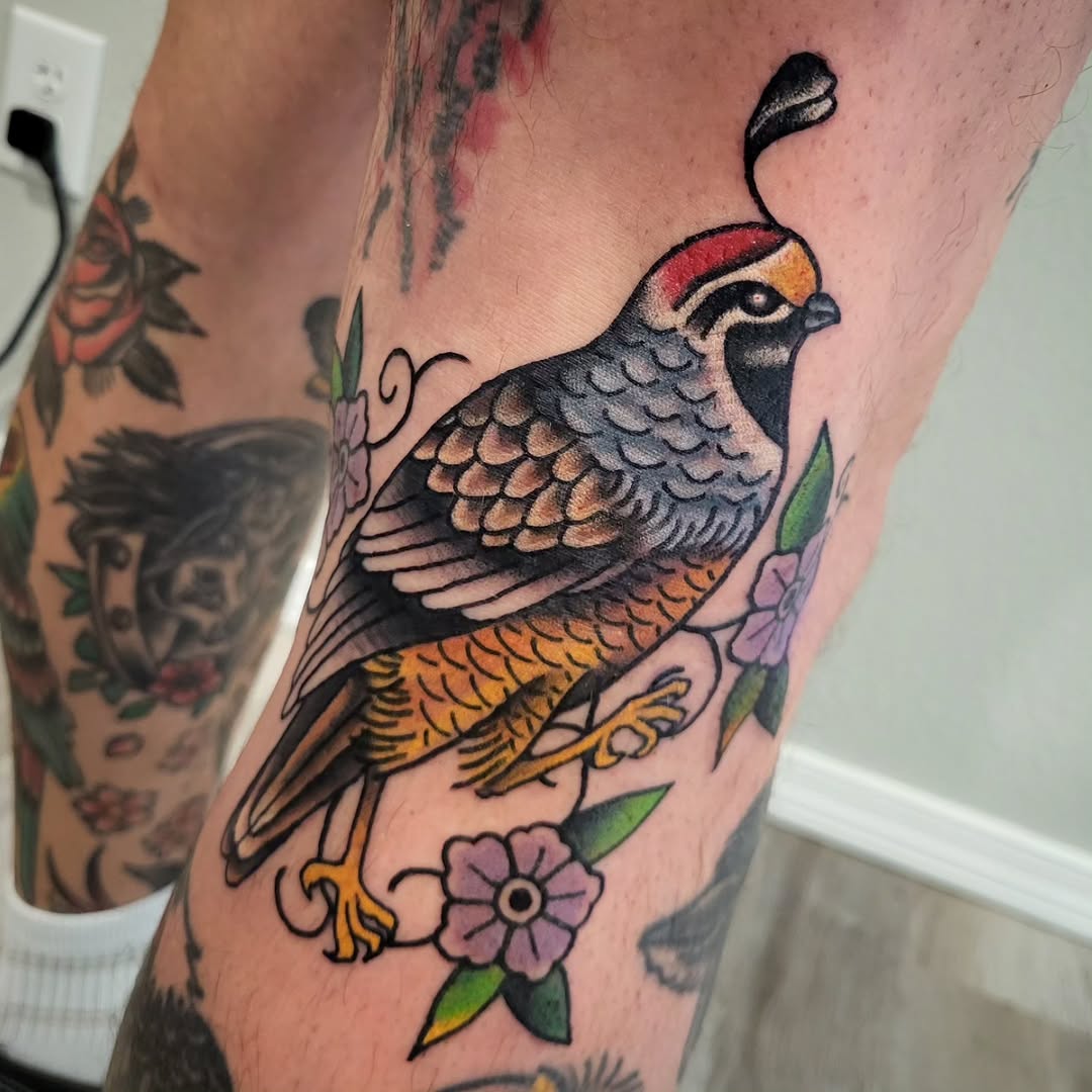 Quail bird with flowers American traditional tattoo on the forearm by Sloan Smith