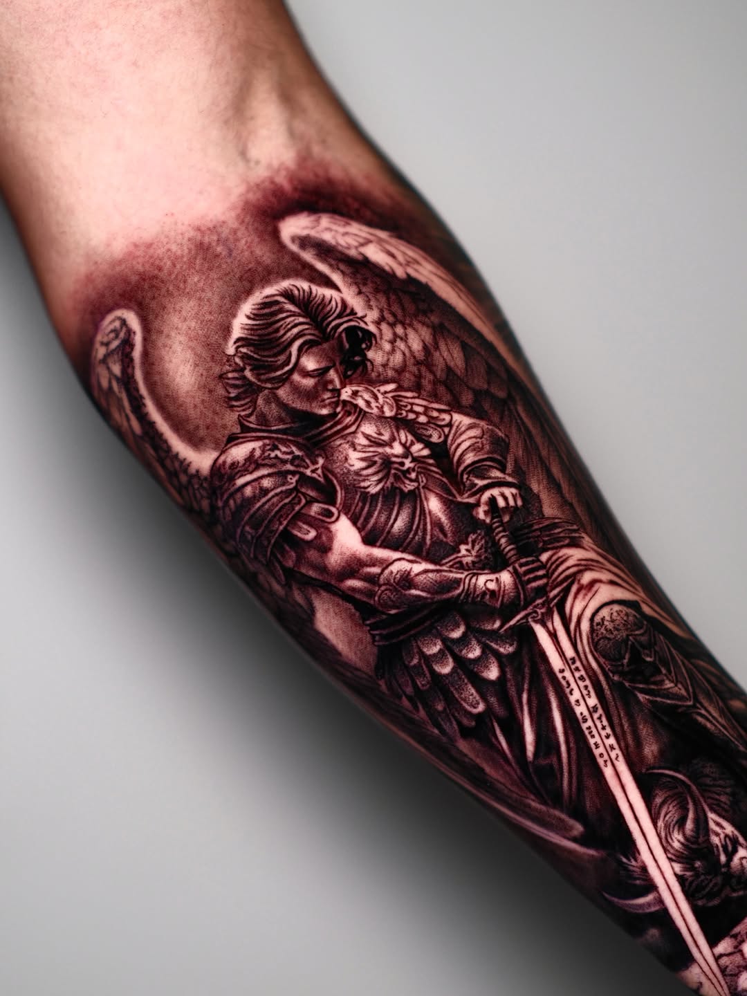 Archangel Michael with sword realism tattoo on the forearm by Dallas tattoo artist