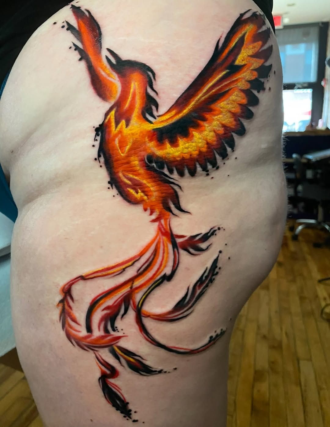 Phoenix realism tattoo on the thigh by High Vibrations