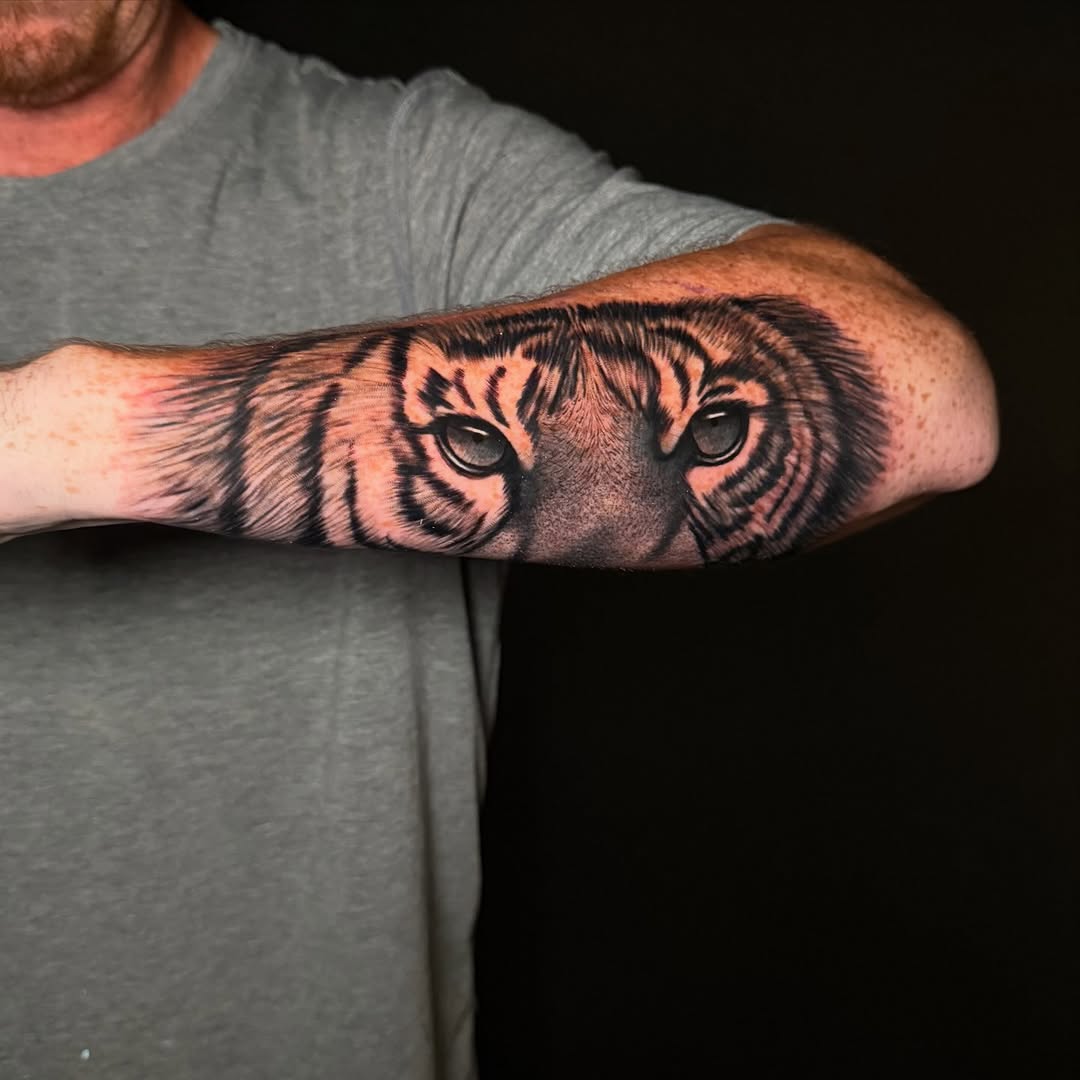 Tiger eyes realism tattoo on the forearm by George Maldonado Austin, Austin, Texas