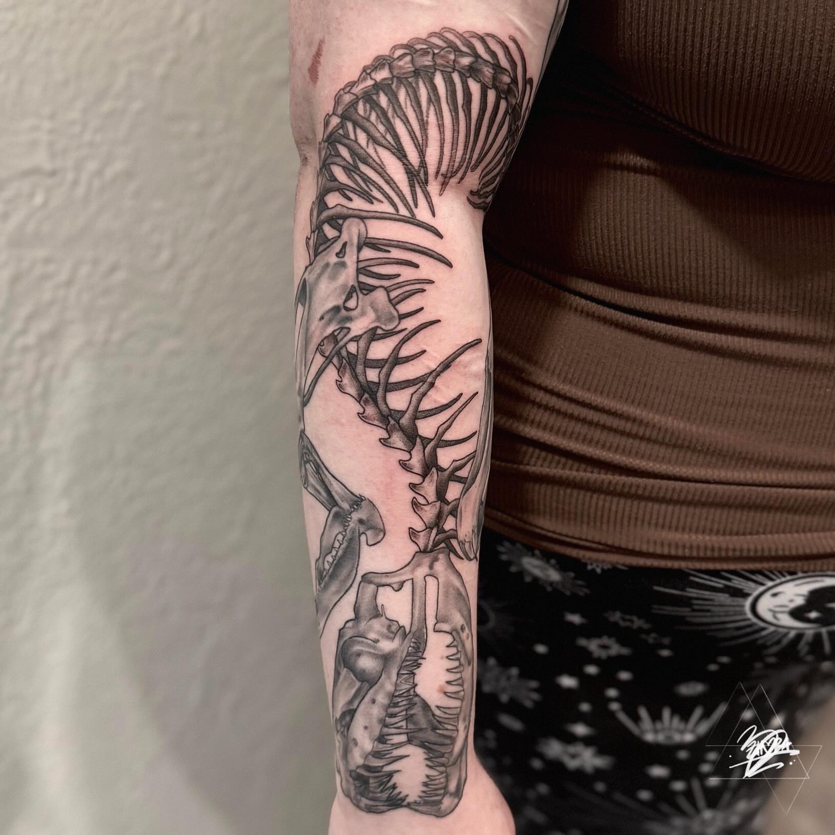 Spine and ribcage black and grey tattoo on the forearm by Zhorana Devi