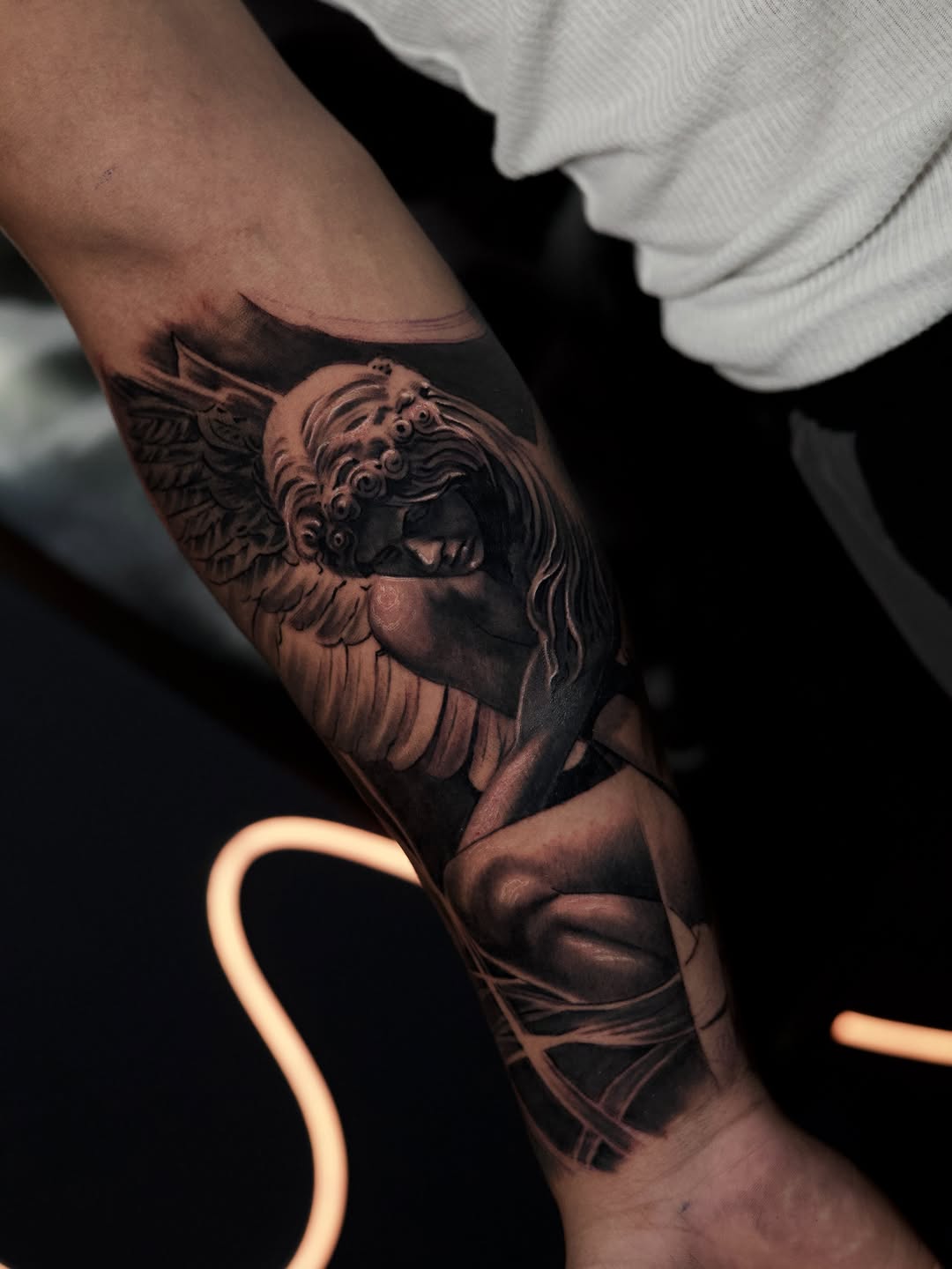 Angelic figure realism tattoo on the forearm by Bapone
