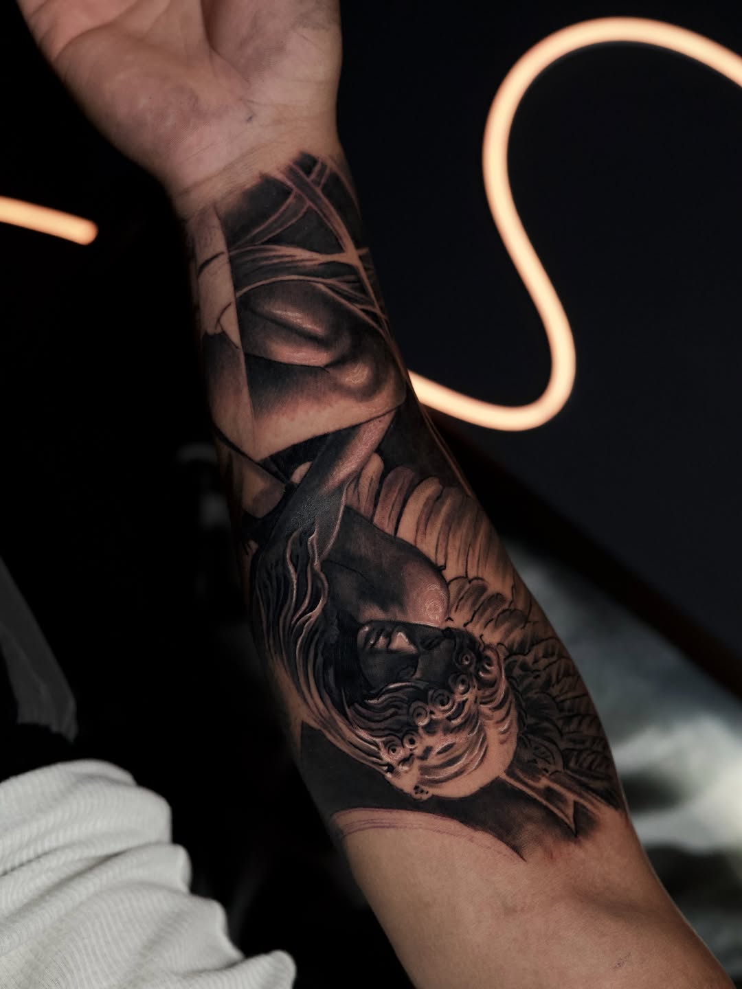 Angelic figure realism tattoo on the forearm by Bapone