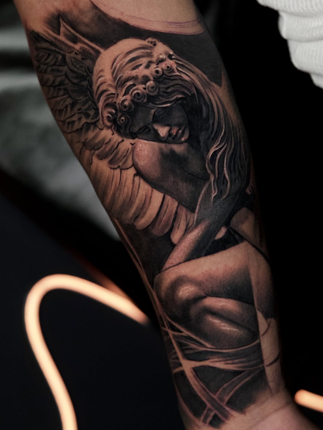 Angel statue realism tattoo on the forearm by Bapone