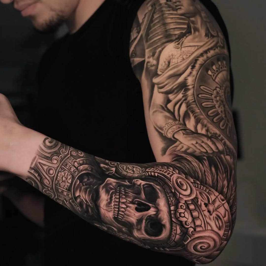 Skull and warrior realism tattoo on the forearm by ink.alchemist