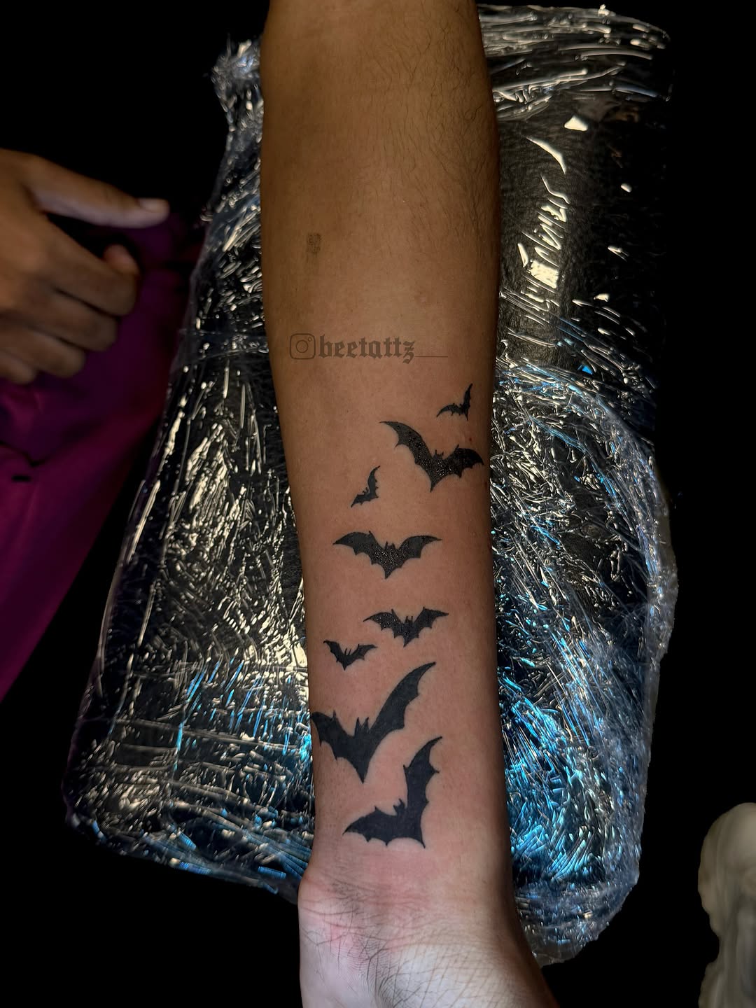 Bats tattoo on the forearm by Brinkley McGill