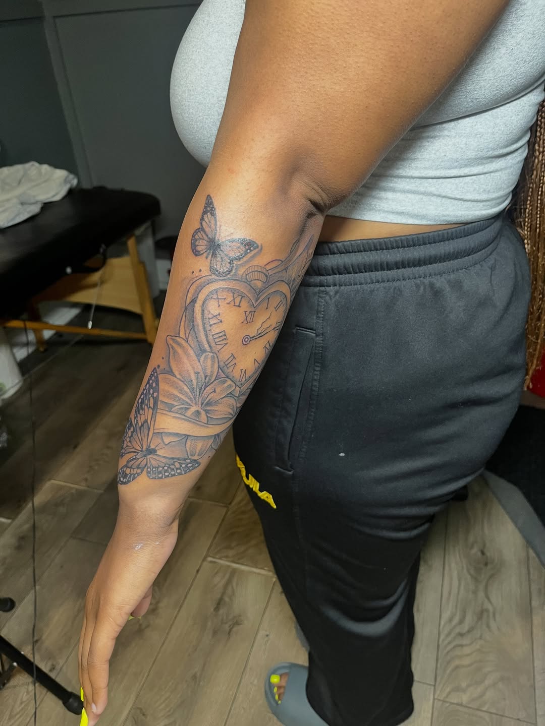 Pocket watch with butterflies and flowers ornamental tattoo on the forearm by SpicyMvstardInkk