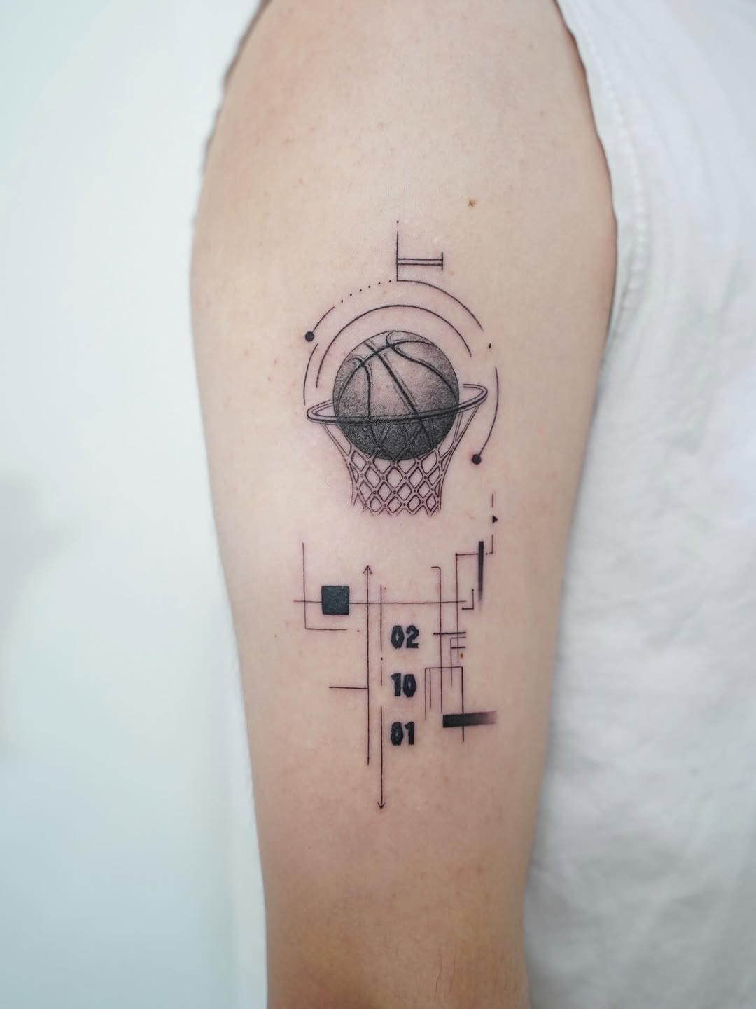 Basketball and geometric design geometric tattoo on the forearm by Tomato