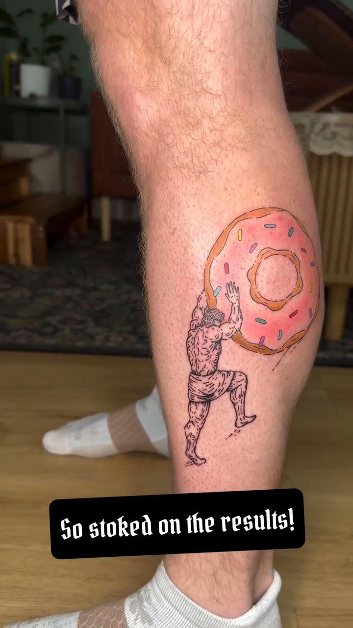 Sisyphus pushing a donut minimalist tattoo on the leg by Fleur ๐ฅ