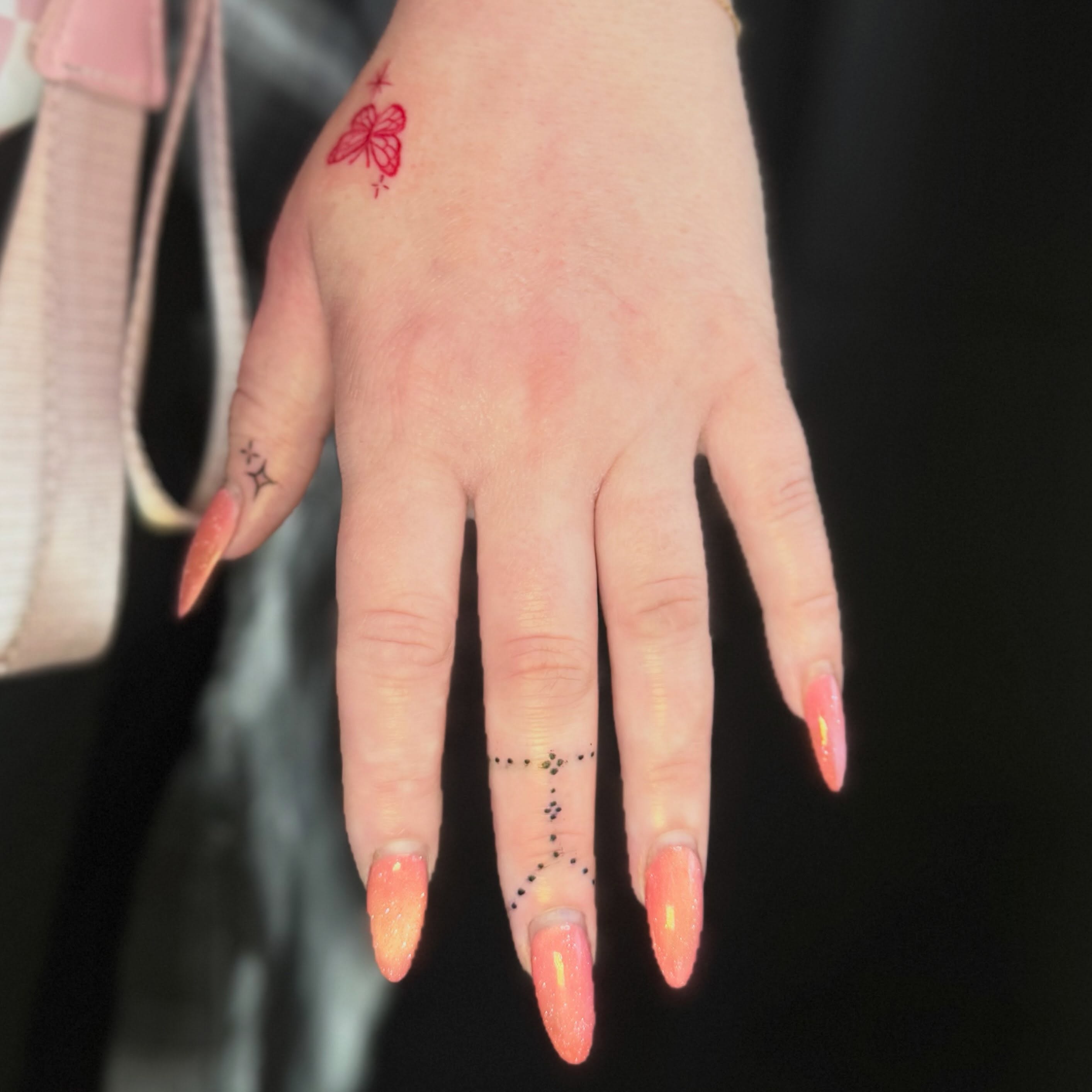 Butterfly dotwork tattoo on the hand by Olivia, Royal Oak, Michigan