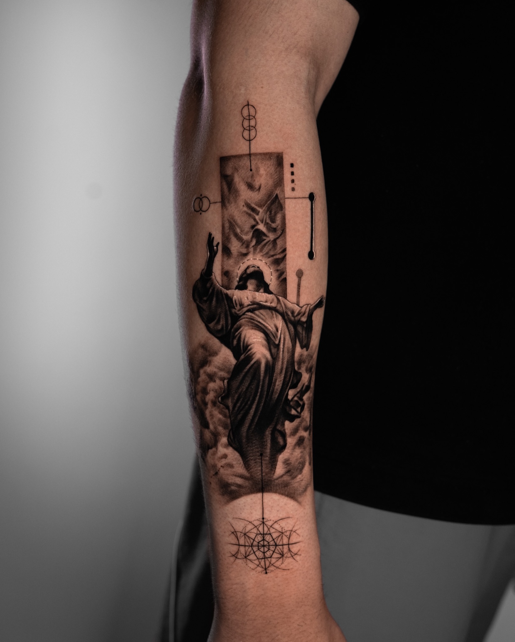 Religious figure realism tattoo on the forearm by Tattoo Artist