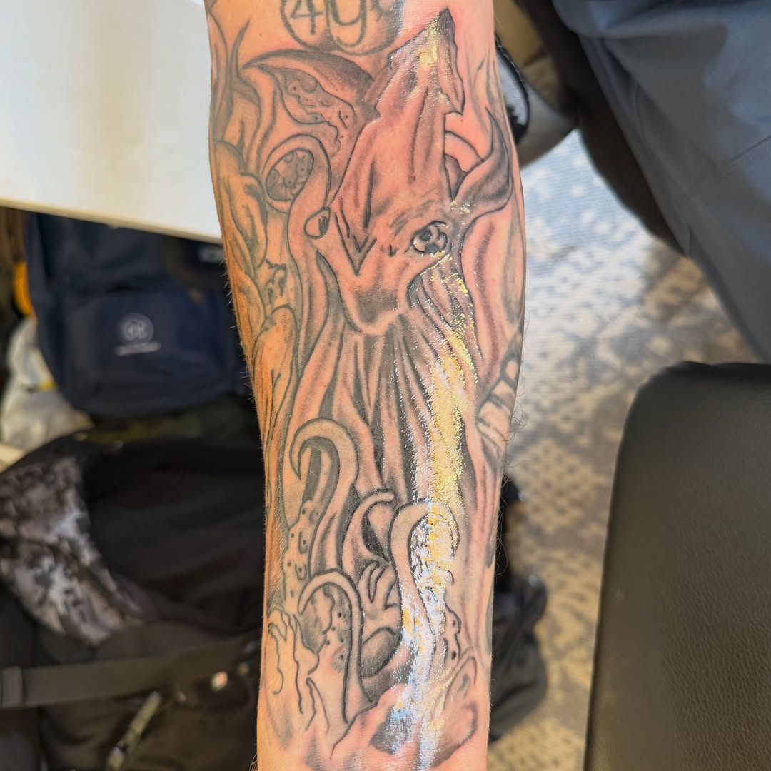 Kraken or squid realism tattoo on the forearm by Addison Bruce