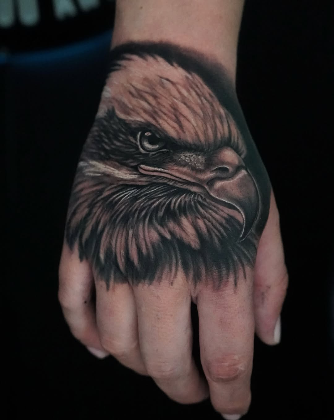 Eagle head realism tattoo on the hand by Carlos Trujillo