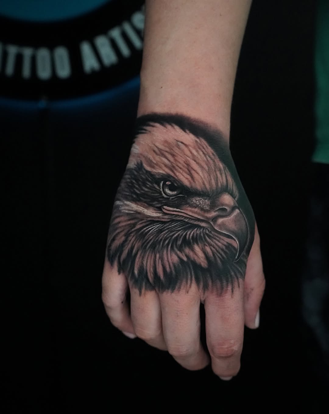 Eagle head realism tattoo on the hand by Carlos Trujillo