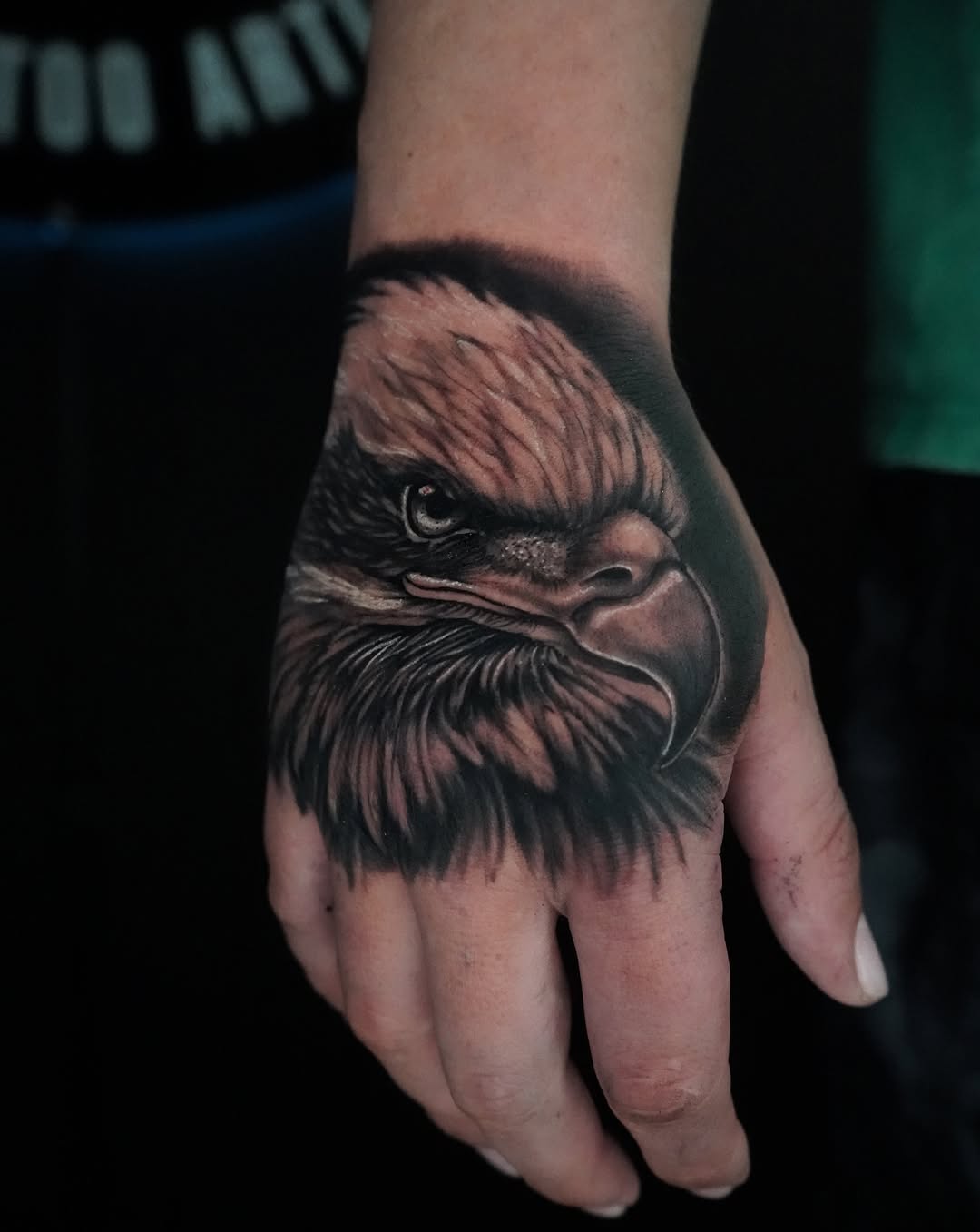 Eagle head realism tattoo on the hand by Carlos Trujillo