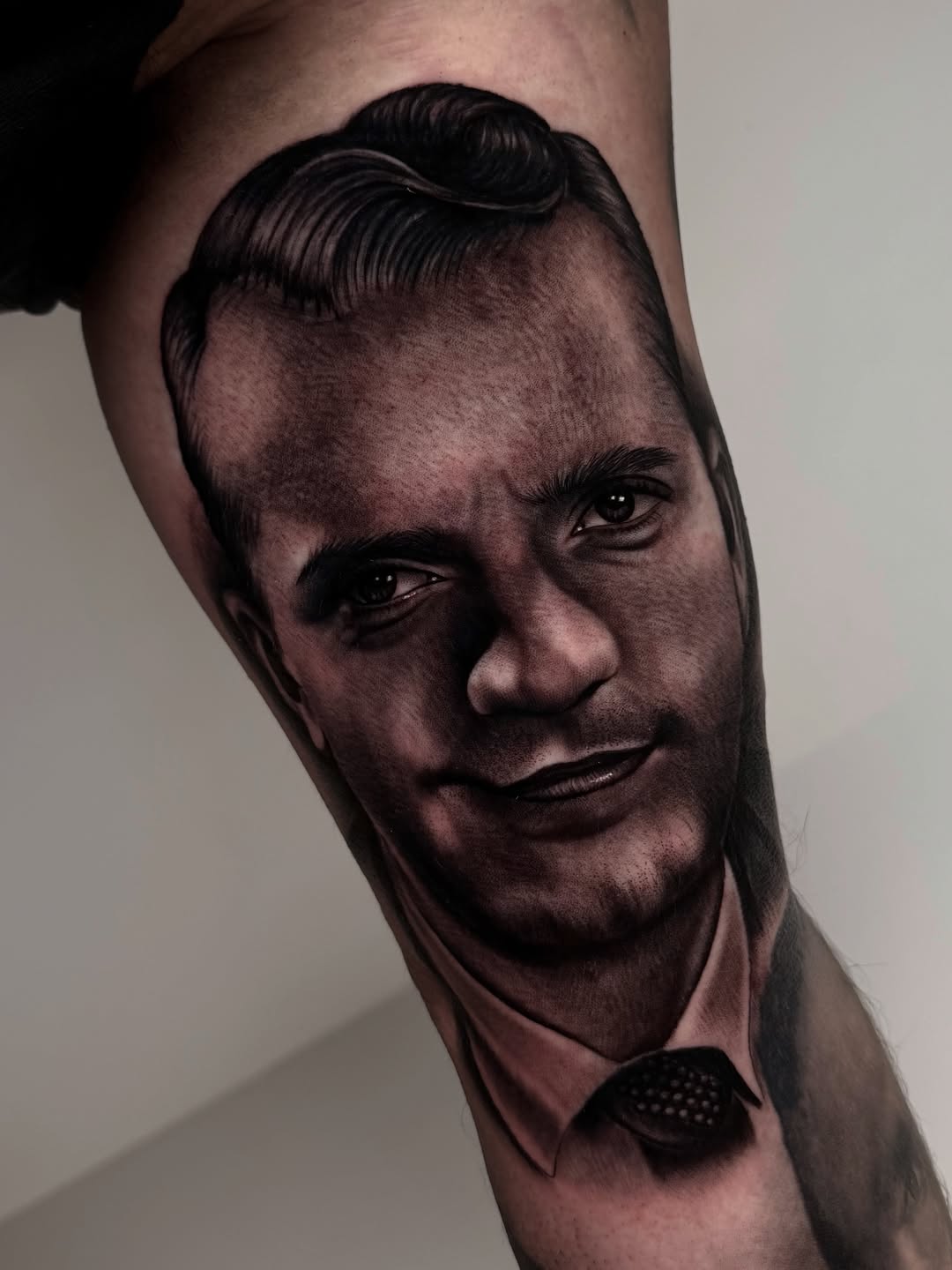 Portrait of a man realism tattoo on the forearm by Fernando Andrade Jr