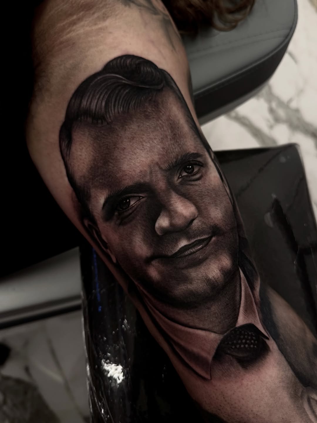 Portrait of a man realism tattoo on the forearm by Fernando Andrade Jr