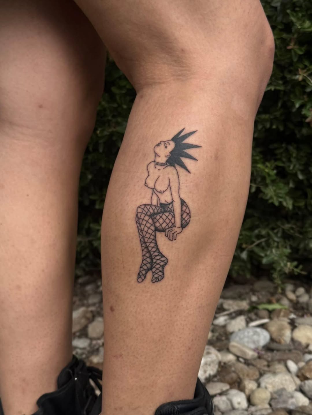 Punk woman in fishnets minimalist tattoo on the thigh by Cullen-Lee