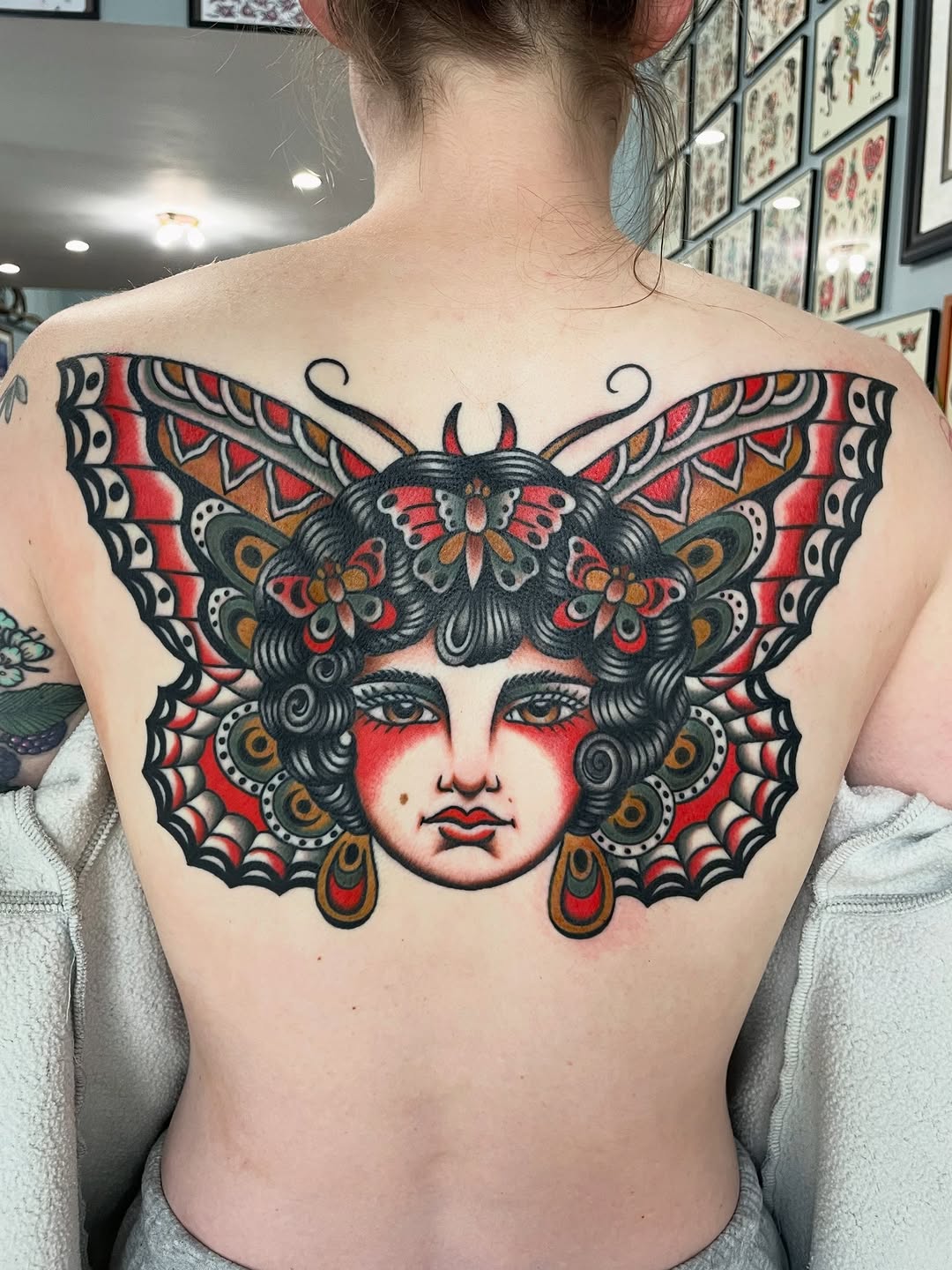 Woman with butterfly wings neo-traditional tattoo on the back by Kat, Sacramento, California