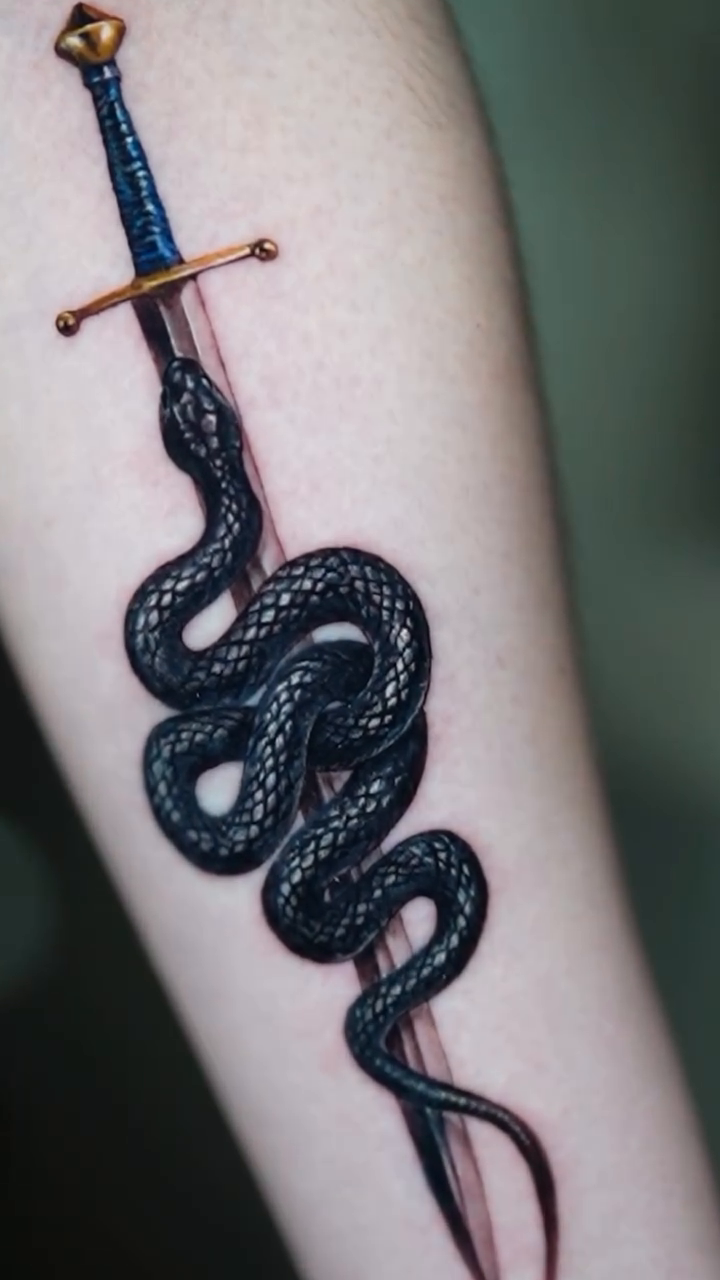 Snake wrapped around a sword American traditional tattoo on the forearm by Eun, Toronto, Ontario