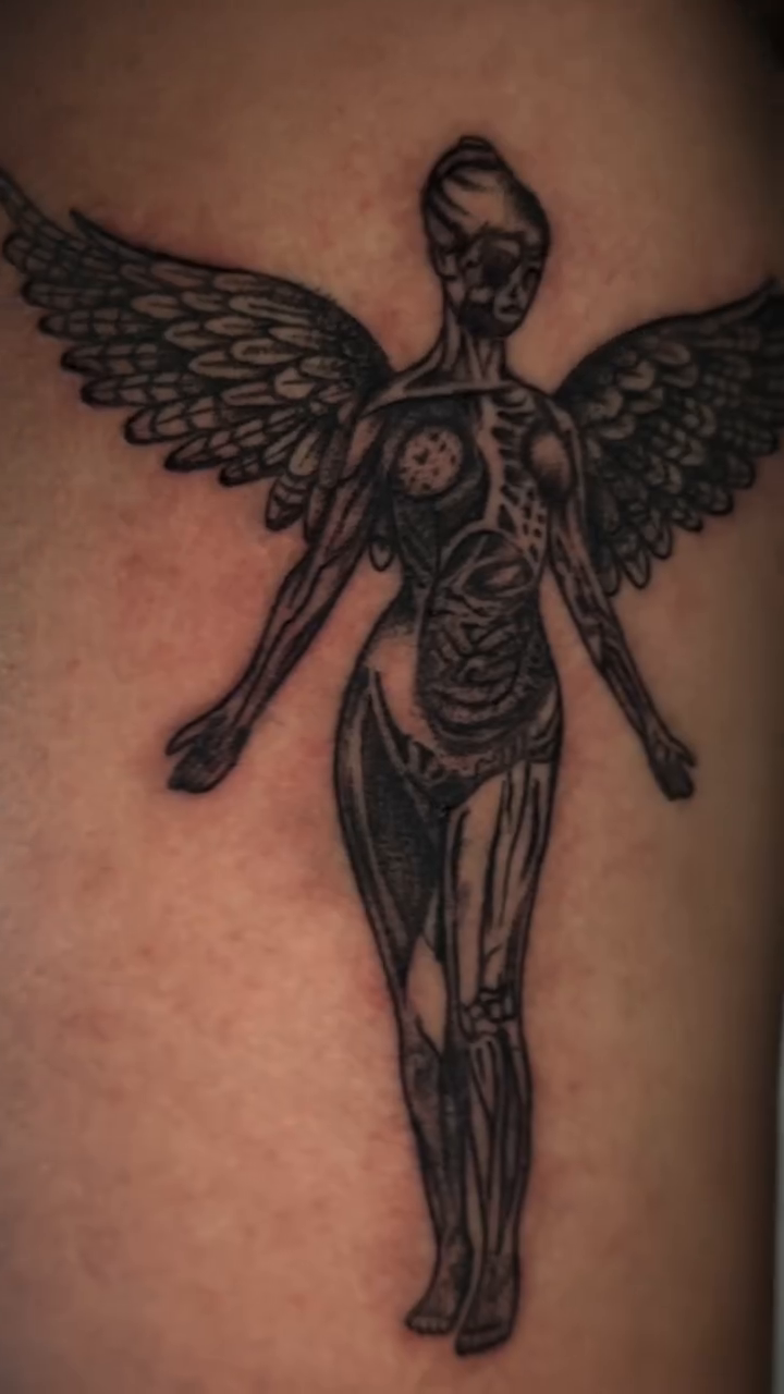 Nirvana 'In Utero' angel realism tattoo on the shoulder by 𝕽𝖆𝖈𝖍𝖊𝖑 𝕽𝖆𝖉𝖎𝖈𝖆𝖑 Queens Tattooer
