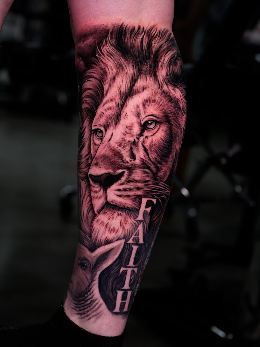 Lion and lamb with text realism tattoo on the forearm by Ink Warden  Tattoo