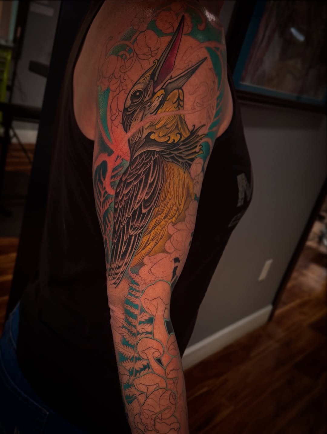 Bird with floral and mushroom elements Japanese tattoo on the forearm by David goldstein