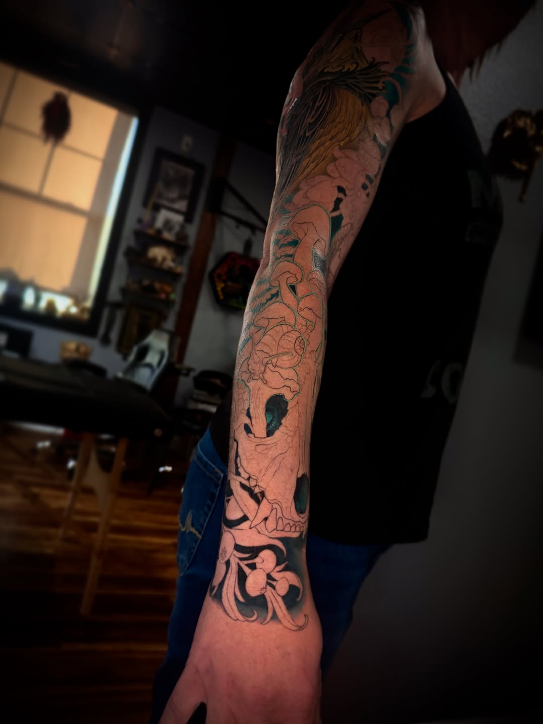 Skull and floral elements Japanese tattoo on the forearm by David goldstein