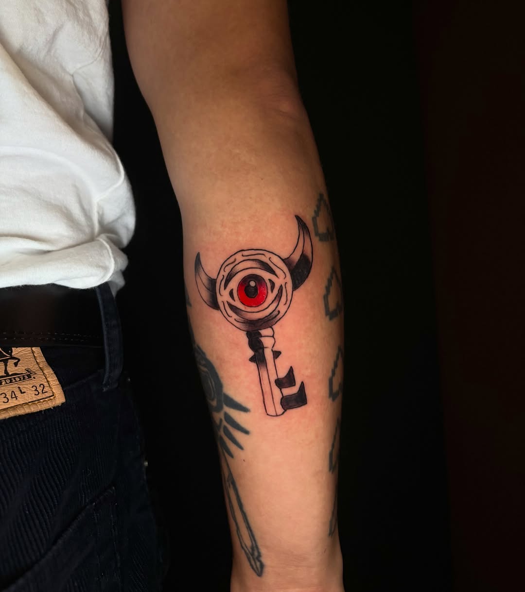 Key with eye and horns dark art tattoo on the forearm by ๐ฎ๐๐๐๐๐๐ ๐ฝ๐๐ โ