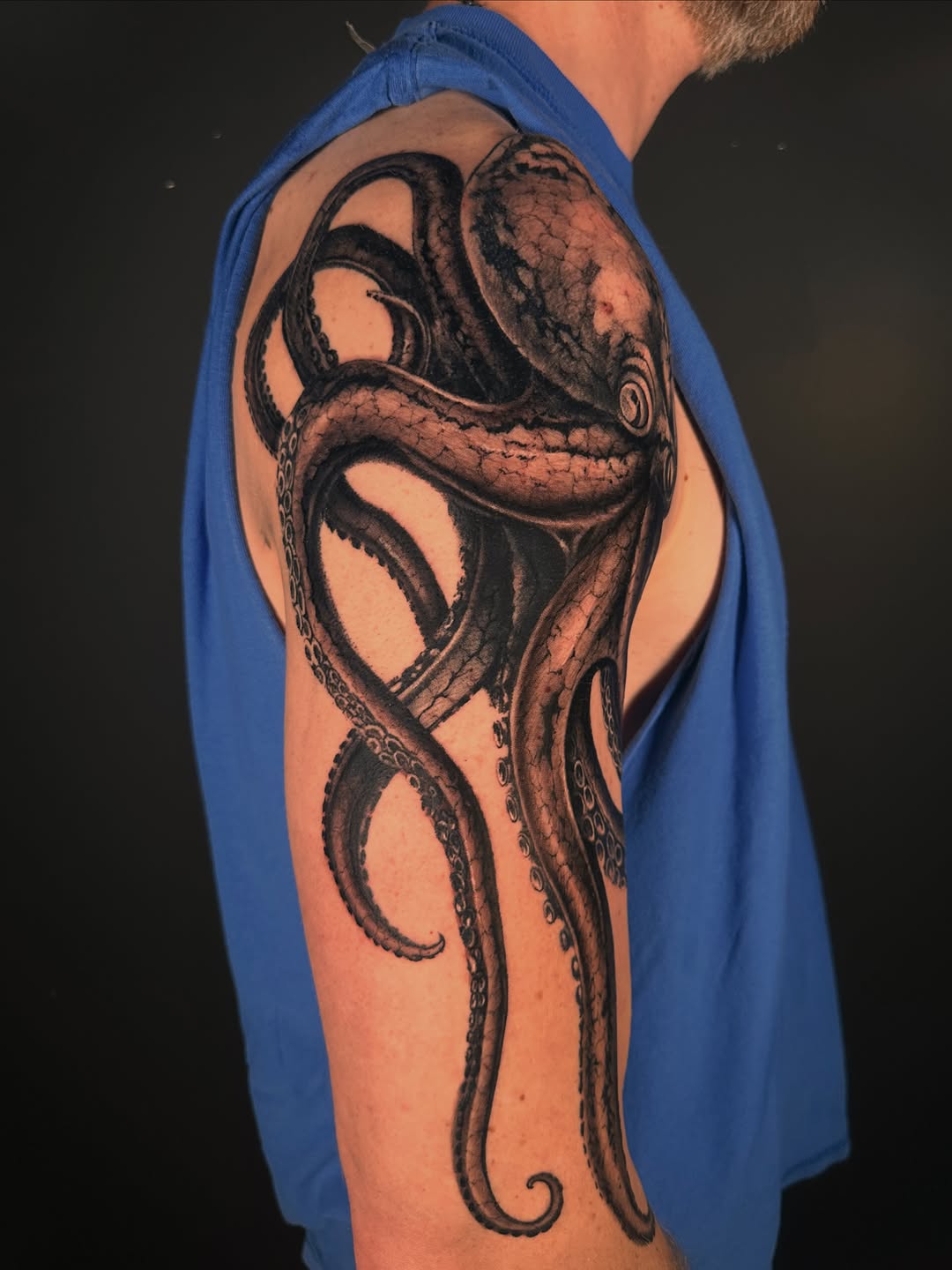 Octopus realism tattoo on the upper arm by Shihao zhao