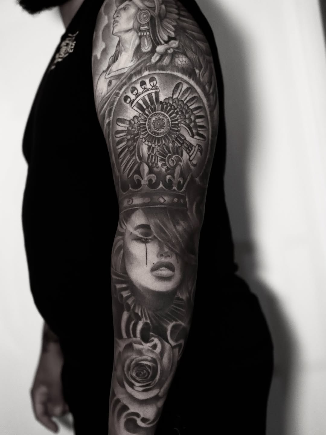 Woman with crown and eagle emblem realism tattoo on the forearm by elvis flores