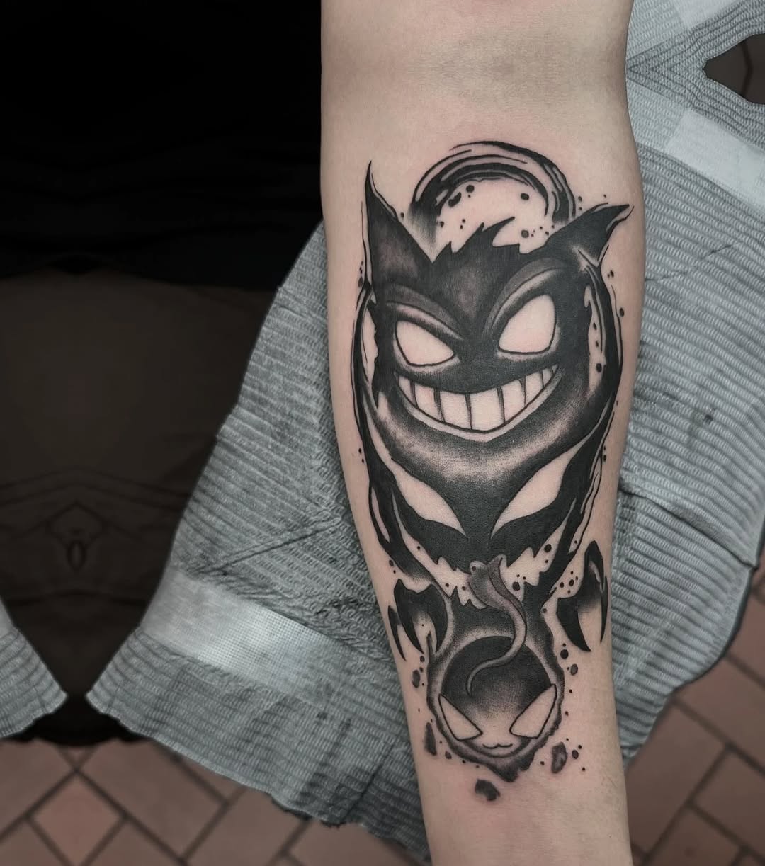 Gengar and Gastly new school tattoo on the forearm by Greyson Heidenreich