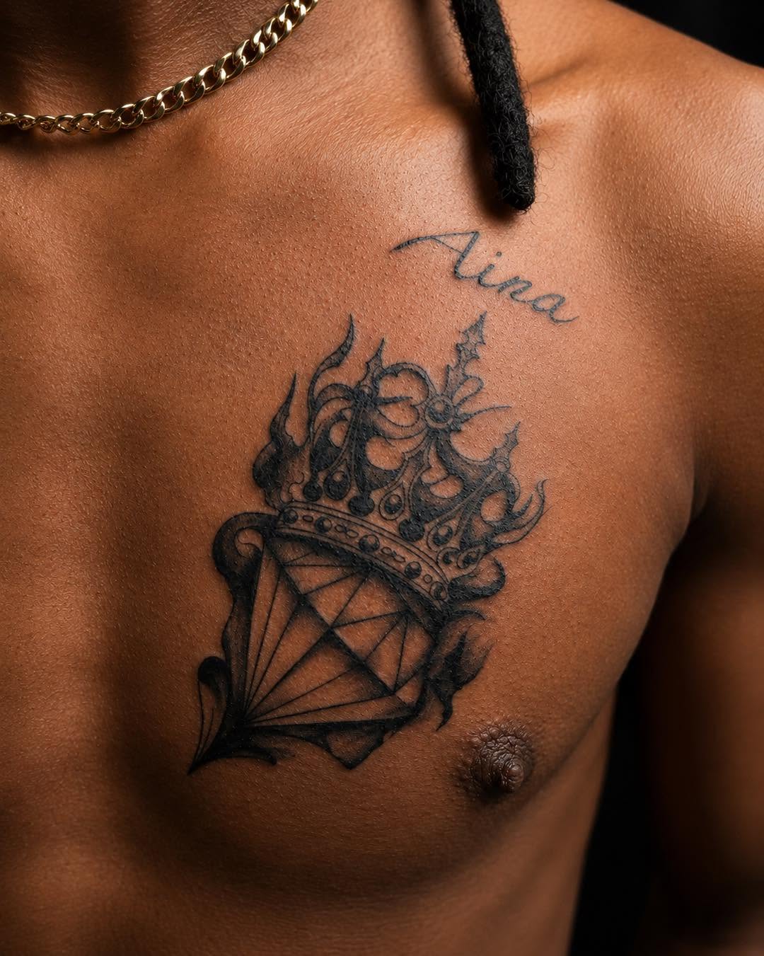 Diamond and crown tattoo on the chest by Flamboyant