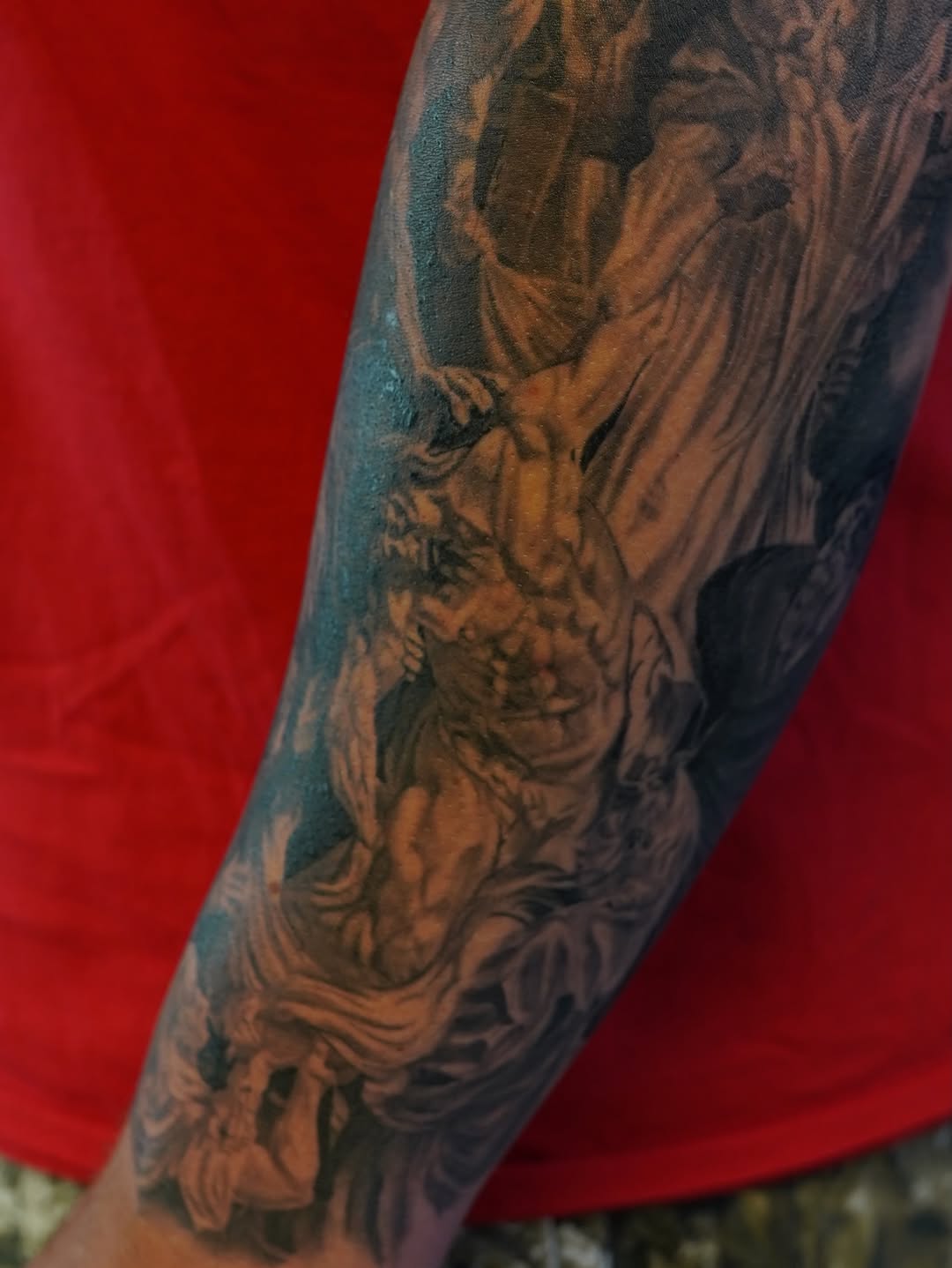 Classical figures realism tattoo on the forearm by Eric RudeInk