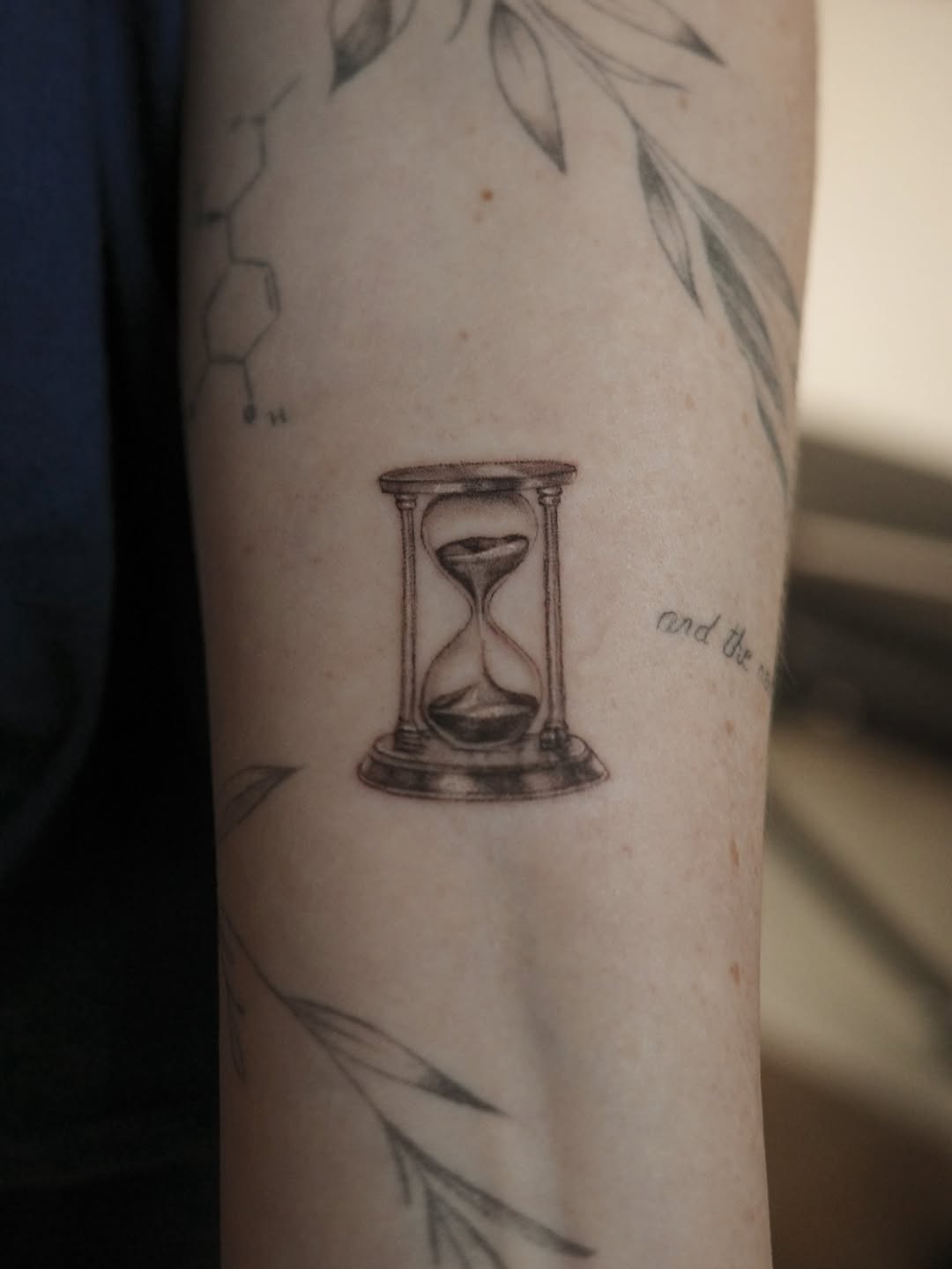 Hourglass surrealism tattoo on the forearm by It’s ya girl, KB