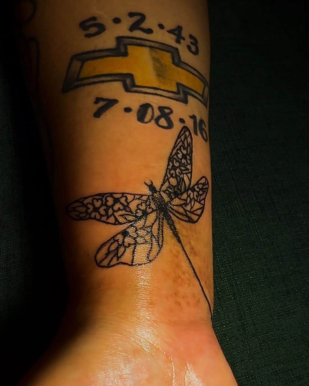 Dragonfly and dates tattoo on the forearm by RVA Tattoo Artist