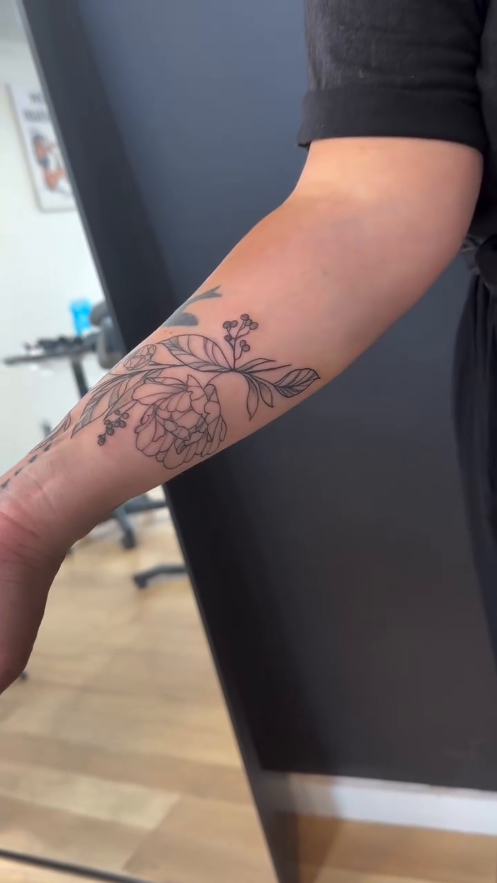 Floral sleeve with a bird fine line tattoo on the forearm by TolzinInk, Brookings, South Dakota