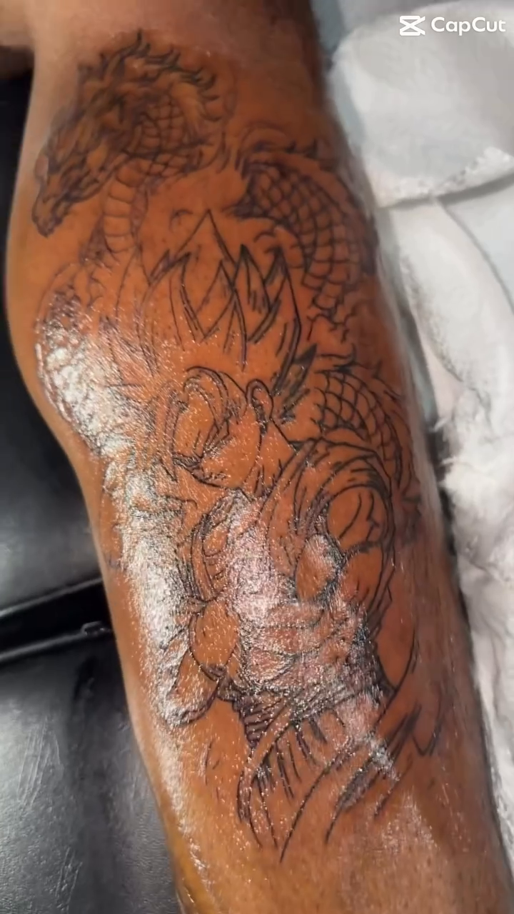 Dragon and roses tattoo anime tattoo on the upper arm by @bloodline__legacy
